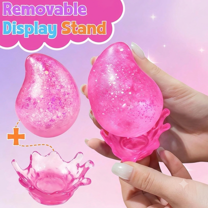 Dream Drop Glitter Slow-Rise Sugar Squish Squeeze Toy w/ Removable Splash Display Stand