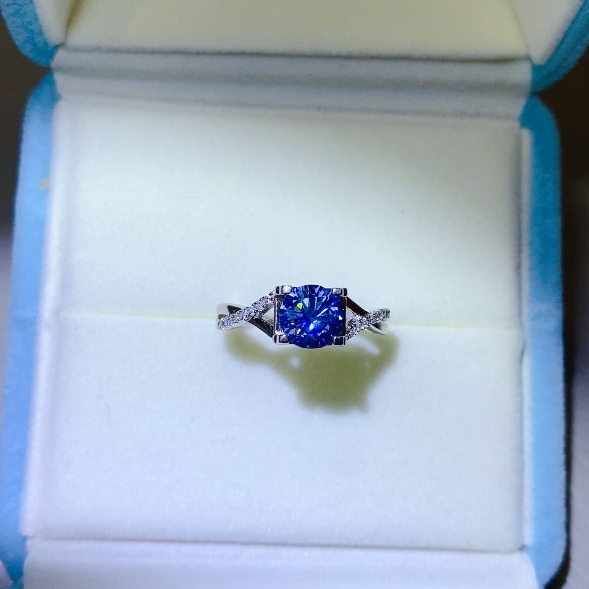 1 Carat Blue Brilliant Round Cut Sparkala™ Crisscross Pure Sterling Silver Ring
